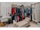 Spacious closet featuring custom shelving, a vanity with seating, and ample storage solutions at 5313 Windy Grove Dr, Wimauma, FL 33598