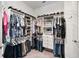 Well-designed walk-in closet with multi-level storage for clothing, shoes, and accessories at 5313 Windy Grove Dr, Wimauma, FL 33598