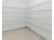 Spacious walk-in pantry featuring well-organized wire shelving and durable tile flooring at 5313 Windy Grove Dr, Wimauma, FL 33598