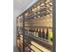 Climate-controlled wine storage with custom racking, display lighting, and secure bottle placement at 5313 Windy Grove Dr, Wimauma, FL 33598