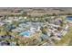 Aerial view of the community showcasing the pool, tennis courts, and clubhouse at 5403 Avenal Dr, Lutz, FL 33558