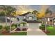 Charming two-story home with lush landscaping, private driveway and a two-car garage at 5403 Avenal Dr, Lutz, FL 33558