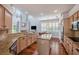 Bright kitchen featuring granite countertops, hardwood floors, and stainless steel appliances at 5403 Avenal Dr, Lutz, FL 33558