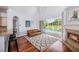 Bright living room offering a fireplace, a comfortable couch, access to the pool and a seamless indoor-outdoor experience at 5403 Avenal Dr, Lutz, FL 33558