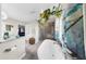 Bright bathroom featuring a garden tub, separate shower, and decorative hanging plants at 613 Fort Duquesna Dr, Sun City Center, FL 33573