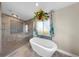 Spa-like bathroom featuring a modern soaking tub and a separate glass-enclosed shower at 613 Fort Duquesna Dr, Sun City Center, FL 33573
