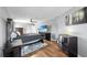 Bedroom with hardwood floors, ceiling fan, and dark furniture, offering a cozy space at 613 Fort Duquesna Dr, Sun City Center, FL 33573