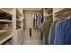 Walk-in closet with custom shelving and organization system to maximize storage at 613 Fort Duquesna Dr, Sun City Center, FL 33573