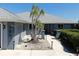 Charming home with a landscaped front yard, featuring a well-maintained lawn and decorative lighting at 613 Fort Duquesna Dr, Sun City Center, FL 33573