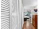 Inviting hallway with wood floors and closet, leading to a bedroom with natural light at 613 Fort Duquesna Dr, Sun City Center, FL 33573