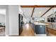 Modern kitchen with a large island, stainless steel appliances, and an open view to the living area at 613 Fort Duquesna Dr, Sun City Center, FL 33573