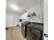 Well-lit laundry room with modern appliances, white cabinets, and tile flooring for a clean and functional space at 613 Fort Duquesna Dr, Sun City Center, FL 33573