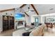 Cozy living room with a fireplace, TV, vaulted ceilings and comfortable seating at 613 Fort Duquesna Dr, Sun City Center, FL 33573