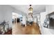 Open concept living area with hardwood floors seamlessly connects the kitchen and living spaces at 613 Fort Duquesna Dr, Sun City Center, FL 33573