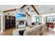 Cozy living room with a fireplace, TV, vaulted ceilings and comfortable seating at 613 Fort Duquesna Dr, Sun City Center, FL 33573