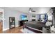 Spacious main bedroom featuring a sitting area, fan, and hardwood floors at 613 Fort Duquesna Dr, Sun City Center, FL 33573