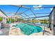 Gorgeous lanai with covered pool and views of the lake at 613 Fort Duquesna Dr, Sun City Center, FL 33573