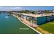 Waterfront condo complex has a shared dock, boat access, new seawall, and lush landscaping at 6161 Gulf Winds Dr # 338, St Pete Beach, FL 33706