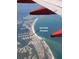 An aerial view showing beach homes on the island with access to the water at 6161 Gulf Winds Dr # 338, St Pete Beach, FL 33706