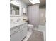 Cozy bathroom featuring a white vanity with marble countertop, a toilet, and a shower with a patterned curtain at 6161 Gulf Winds Dr # 338, St Pete Beach, FL 33706