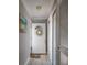 Inviting entryway with a white door and charming decor leads into a bright, welcoming home at 6161 Gulf Winds Dr # 338, St Pete Beach, FL 33706