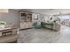 Inviting living room with neutral decor, built-in shelving, and bright windows at 6161 Gulf Winds Dr # 338, St Pete Beach, FL 33706