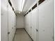 A storage area featuring multiple white storage units, providing secure and organized space at 6161 Gulf Winds Dr # 338, St Pete Beach, FL 33706