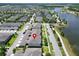 Community aerial view highlighting a neighborhood of townhomes with scenic lakes and beautiful landscaping at 6325 Shore Vista Pl, Apollo Beach, FL 33572