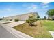 View of a residential street featuring a well-manicured lawn and landscaping at 6325 Shore Vista Pl, Apollo Beach, FL 33572