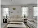 Bright living room with comfortable seating, light walls, and modern decor at 6325 Shore Vista Pl, Apollo Beach, FL 33572