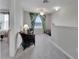 Bright loft area featuring comfortable chairs and natural light streaming in through a nearby window at 6325 Shore Vista Pl, Apollo Beach, FL 33572