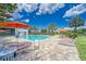 Relaxing community pool with lounge chairs and orange umbrellas for shade and enjoyment at 6325 Shore Vista Pl, Apollo Beach, FL 33572