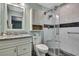 Bathroom featuring granite countertops, walk-in shower, and vanity with storage at 6375 Ocean Pines Ln, Spring Hill, FL 34606