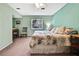 Bedroom featuring carpeted floors, natural light, ceiling fan and calm color palette at 6375 Ocean Pines Ln, Spring Hill, FL 34606