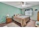 Cozy bedroom with a ceiling fan, ample natural light, and a calm color palette at 6375 Ocean Pines Ln, Spring Hill, FL 34606