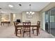 Dining room featuring carpeted floor and sliding glass doors to the backyard at 6375 Ocean Pines Ln, Spring Hill, FL 34606