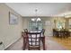Dining room featuring a chandelier and sliding glass doors to the outside at 6375 Ocean Pines Ln, Spring Hill, FL 34606