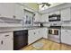 Bright kitchen features stainless steel appliances, updated countertops, and sleek black dishwasher at 6375 Ocean Pines Ln, Spring Hill, FL 34606