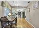 Kitchen featuring a cozy dining area, white cabinets, and stainless steel appliances at 6375 Ocean Pines Ln, Spring Hill, FL 34606