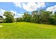 View of expansive backyard that offers ample space for outdoor activities at 6416 Cobble Bliss St, Zephyrhills, FL 33541