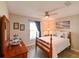 Bright bedroom features decorative art, a ceiling fan, and hardwood style flooring at 6416 Cobble Bliss St, Zephyrhills, FL 33541