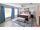 Inviting main bedroom features cool toned walls, a decorative rug, and a bench seat at 6416 Cobble Bliss St, Zephyrhills, FL 33541