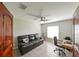 Home office with tile floors, neutral paint, a ceiling fan, and a desk with a chair at 6416 Cobble Bliss St, Zephyrhills, FL 33541