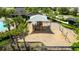 Playground featuring a large sun shade, slide, and swings at 6416 Cobble Bliss St, Zephyrhills, FL 33541