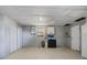 Unfinished basement with tiled floors, window AC and ample space for storage or a rec room at 6936 77Th N Ter, Pinellas Park, FL 33781