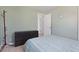 A serene bedroom featuring a light wall color, minimalist décor, and a spacious six-drawer dresser at 6936 77Th N Ter, Pinellas Park, FL 33781