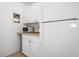 Bright kitchen featuring white appliances and ample cabinet space at 6936 77Th N Ter, Pinellas Park, FL 33781
