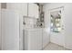 Laundry room with washer, dryer, storage, and natural light at 6936 77Th N Ter, Pinellas Park, FL 33781