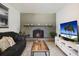 Bright living room featuring a fireplace, comfortable sofa and a flat screen television at 6936 77Th N Ter, Pinellas Park, FL 33781