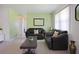 Comfortable living room featuring two sofas, neutral paint, and bright window at 6936 77Th N Ter, Pinellas Park, FL 33781